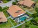 Aerial view showcasing a beautiful pool and backyard bordered by a white fence at 3939 Sunset Lake Dr, Lakeland, FL 33810