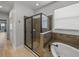 Bathroom featuring glass shower and tub, blending style and functionality at 3939 Sunset Lake Dr, Lakeland, FL 33810