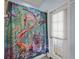 Shower area featuring a unique and colorful mermaid themed shower curtain, tile flooring, and white walls at 3939 Sunset Lake Dr, Lakeland, FL 33810
