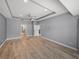 Expansive primary bedroom with tray ceilings, tile floors, and ensuite access at 3939 Sunset Lake Dr, Lakeland, FL 33810