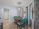 Bright breakfast nook featuring a wooden table, four chairs, and window with patterned curtains at 3939 Sunset Lake Dr, Lakeland, FL 33810