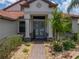 Charming front entrance featuring a brick pathway and lush landscaping leading to a beautiful home at 3939 Sunset Lake Dr, Lakeland, FL 33810