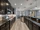 Bright kitchen featuring dark cabinetry, a breakfast bar and stainless steel dishwasher at 3939 Sunset Lake Dr, Lakeland, FL 33810
