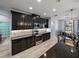 Beautiful kitchen with black cabinets, stainless steel appliances, and modern finishes at 3939 Sunset Lake Dr, Lakeland, FL 33810