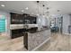 Gourmet kitchen with updated cabinets, backsplash, and a breakfast bar at 3939 Sunset Lake Dr, Lakeland, FL 33810