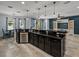 Open kitchen with bar seating, stainless appliances, and a view of the living area at 3939 Sunset Lake Dr, Lakeland, FL 33810