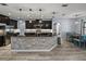 Well-equipped kitchen with a large island, modern lighting, and dining area at 3939 Sunset Lake Dr, Lakeland, FL 33810