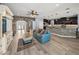 Spacious living room featuring tiled floors, a brick archway, and comfortable blue sofa at 3939 Sunset Lake Dr, Lakeland, FL 33810