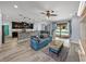 Bright open concept living room with kitchen, dining, living and open pool access at 3939 Sunset Lake Dr, Lakeland, FL 33810