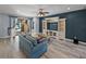 Bright living room with open sliding doors to pool area and built-in shelving at 3939 Sunset Lake Dr, Lakeland, FL 33810