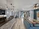 Open living space featuring the kitchen, dining nook, and living room with an outdoor view at 3939 Sunset Lake Dr, Lakeland, FL 33810