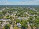 Wide aerial panorama displaying the property's place in a tree-lined residential area, revealing street layouts at 485 E Stanford St, Bartow, FL 33830