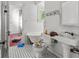 Bathroom featuring a claw foot tub and patterned black and white tile flooring at 485 E Stanford St, Bartow, FL 33830