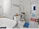 View of a bathroom offering a tub and classic black and white tile floors at 485 E Stanford St, Bartow, FL 33830