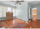 Bedroom with hardwood floors, light blue walls, and windows with natural light at 485 E Stanford St, Bartow, FL 33830