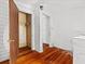 Bedroom with wood floors and a closet visible through the doorway at 485 E Stanford St, Bartow, FL 33830