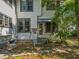 Charming side entrance of the house, featuring a swing and lush landscaping, creating a welcoming atmosphere at 485 E Stanford St, Bartow, FL 33830