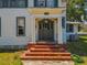 A charming front entryway with brick steps leads to an inviting porch and classic architectural details at 485 E Stanford St, Bartow, FL 33830