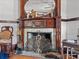 A decorative fireplace with a detailed mantel is the focal point of this cozy room at 485 E Stanford St, Bartow, FL 33830