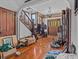 Inviting foyer with hardwood floors, original wood trim, staircase and abundant natural light at 485 E Stanford St, Bartow, FL 33830