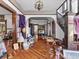 Spacious foyer with hardwood floors, detailed woodwork, and staircase at 485 E Stanford St, Bartow, FL 33830