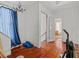 Living room with hardwood floors, a chandelier, and access to additional rooms at 485 E Stanford St, Bartow, FL 33830