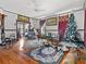 Cozy living room with beautiful hardwood floors, traditional furnishings, and ample natural light at 485 E Stanford St, Bartow, FL 33830