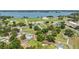 Aerial view of neighborhood homes near a lake, showcasing a peaceful residential community at 652 N Jackson St, Eagle Lake, FL 33839