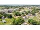 Aerial view of the house surrounded by mature trees in a beautiful, established neighborhood at 652 N Jackson St, Eagle Lake, FL 33839