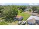 Aerial view of house and the neighborhood showing ample yard and mature trees at 652 N Jackson St, Eagle Lake, FL 33839