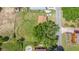 Overhead aerial view shows home, the ample yard, and mature trees at 652 N Jackson St, Eagle Lake, FL 33839