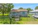 Charming home featuring a small front porch and fenced yard at 652 N Jackson St, Eagle Lake, FL 33839