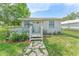 Charming single-story home with a cozy front porch and a well-maintained yard at 652 N Jackson St, Eagle Lake, FL 33839