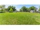 Expansive grassy land with mature trees, perfect for building a dream home at 652 N Jackson St, Eagle Lake, FL 33839