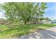 Spacious fenced yard with mature trees, offering privacy and shade at 652 N Jackson St, Eagle Lake, FL 33839