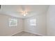 A bright bedroom features new laminate flooring, fresh paint, a ceiling fan, and lots of natural light at 728 Trenton Rd, Lakeland, FL 33815
