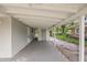 Spacious carport featuring ample covered parking and additional storage space in an enclosed area at 728 Trenton Rd, Lakeland, FL 33815