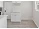 Bright nook space with white shaker cabinets, hard surface floors, and a door to outside at 728 Trenton Rd, Lakeland, FL 33815
