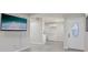 Open living space with fresh paint, hard surface floors, and a mounted TV at 728 Trenton Rd, Lakeland, FL 33815