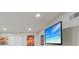 Bright and airy living space highlighting modern lighting and a flat-screen television for entertainment at 728 Trenton Rd, Lakeland, FL 33815