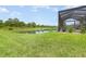 Lush backyard featuring a serene water view, ideal for relaxing and enjoying nature at 3333 Costello Cir, Winter Haven, FL 33884