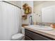 A clean bathroom with a single sink and decorative wicker basket storage at 3333 Costello Cir, Winter Haven, FL 33884