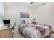 Serene bedroom with a desk area, soft carpet, and a soothing color palette at 3333 Costello Cir, Winter Haven, FL 33884