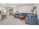 Spacious living room with a comfortable sectional sofa, open to the kitchen and dining area at 3333 Costello Cir, Winter Haven, FL 33884