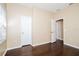 Bedroom features hardwood floors, neutral paint, and large windows for natural light at 4526 Ficus Tree Rd, Kissimmee, FL 34758