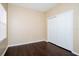 Bright bedroom features wood floors, natural light and a closet with folding doors at 4526 Ficus Tree Rd, Kissimmee, FL 34758