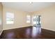 Bright and airy living room with gleaming hardwood floors and natural light at 4526 Ficus Tree Rd, Kissimmee, FL 34758