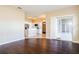 Open-concept floor plan with hardwood floors and white trim throughout the living spaces at 4526 Ficus Tree Rd, Kissimmee, FL 34758