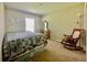 Bedroom with a comfortable bed, vanity, and natural light at 6376 Sw 117Th Street Rd, Ocala, FL 34476