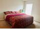 Comfortable bedroom with carpet and a decorative nightstand under the window at 6376 Sw 117Th Street Rd, Ocala, FL 34476